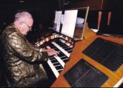 George Smith at the console of the Wurlitzer at Vincennes University